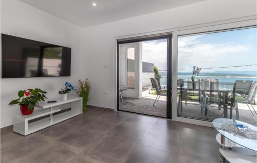 a living room with a view of the ocean at Gorgeous Home In Dramalj in Dramalj