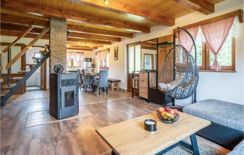 a living room with a couch and a table at Lovely Home In Gornje Pazariste in Donje Pazarište