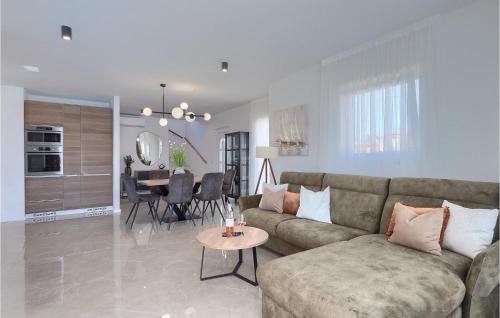 a living room with a couch and a table at Villa Veduta in Pula