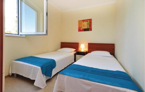 Postel nebo postele na pokoji v ubytování Apartment Mimice With Sea View 381