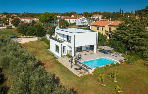 an aerial view of a house with a swimming pool at Villa Auri in Pula