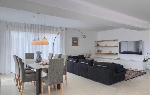 a living room with a table and a couch at Villa Auri in Pula