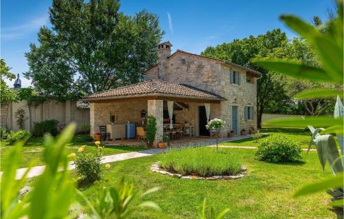 an exterior view of a stone house at Villa Roveria in Butkovići