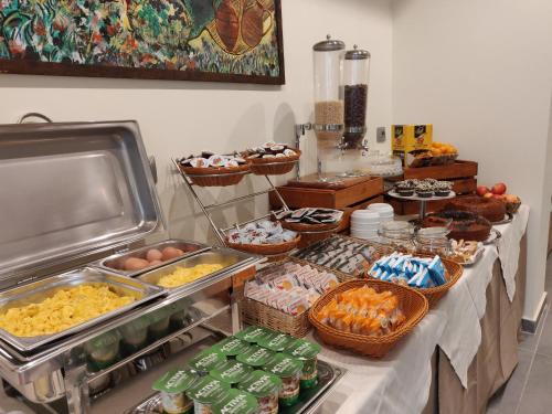 a buffet with eggs and other food on a table at Albergo Conte Max in Capracotta