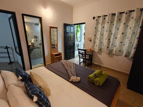 a bedroom with a bed and a couch at SOLS Backyard in Arambol