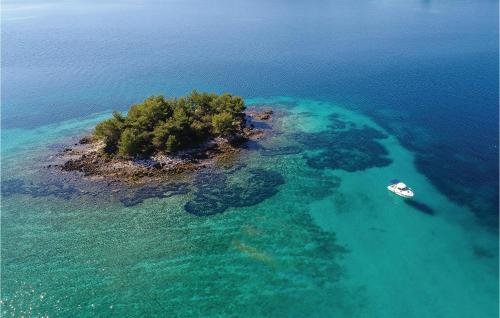 an island in the ocean with a boat in it at Holiday Home Zuljana With Sea View I in Žuljana