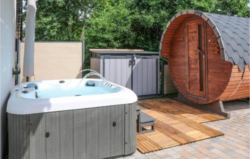 a hot tub on a deck next to a gazebo at Ferienhaus 11 In Kirchheim in Kirchheim