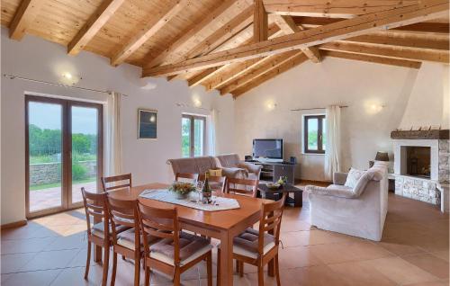 a living room with a wooden table and chairs at Villa Nino in Rovinj