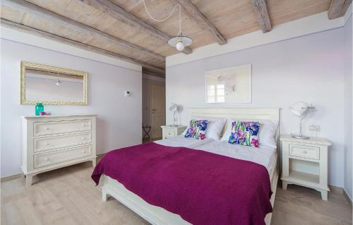a bedroom with a large bed and two night stands at Villa Elizabeta in Umag
