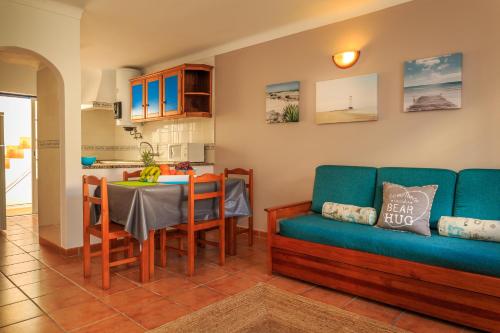 a living room with a couch and a table at Casas do Zé in Odeceixe