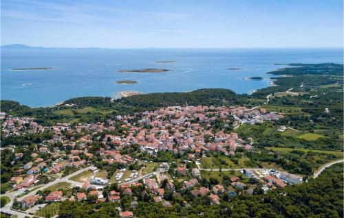 an aerial view of a city and the water at Villa Suprema Premantura in Pula