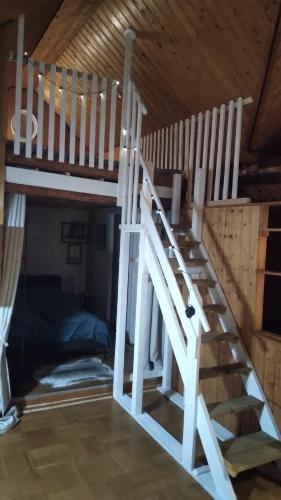 a loft bed with a staircase in a room at 100 Stufen über dem Rhein in Oberwesel