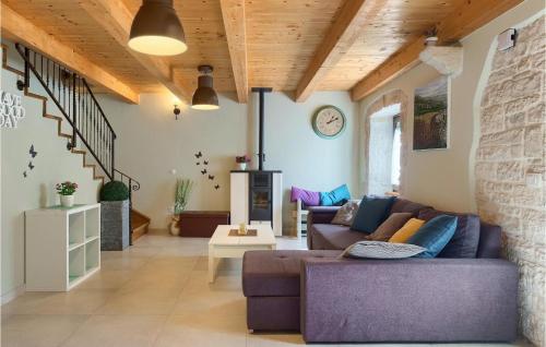 a living room with a couch and a table at Villa Ive in Orbanići