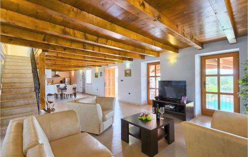 a living room with a couch and a table at Villa Marco in Rovinj