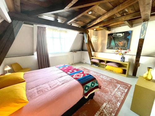 Giường trong phòng chung tại Appartement Zeezicht