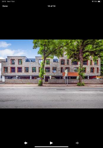 a large building on the side of a street at The Duplex at Sophia Mews with free parking in Cardiff