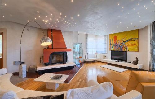 a living room with a couch and a fireplace at Villa Rosa Labin in Labin