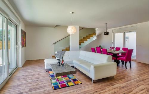 a living room with a white couch and a table at Cld688, Villa Vlahov I in Šibenik