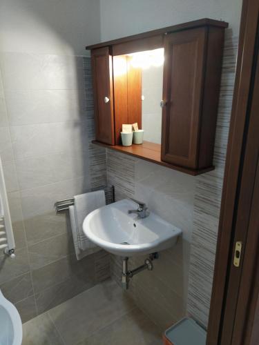 a bathroom with a sink and a medicine cabinet at Antica Masseria Lo Conte in Ariano Irpino