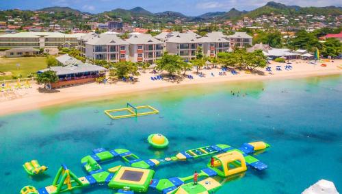 an aerial view of a beach with boats in the water at Private villa with large pool & 5min walk to beach in Cap Estate