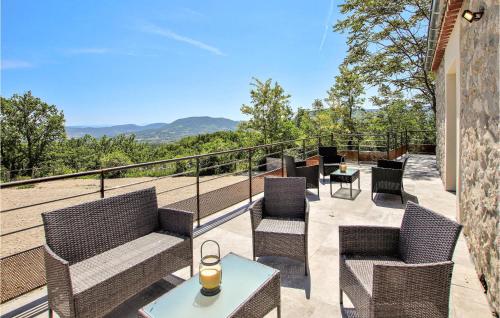 a balcony with chairs and a table with a view at Awesome Home In Alissas in Alissas