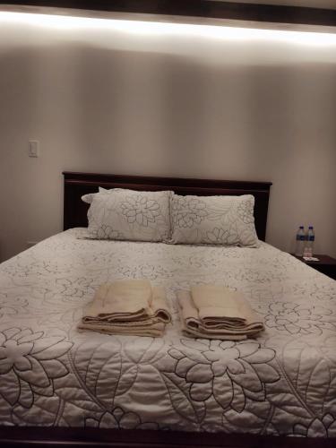 Ein Bett oder Betten in einem Zimmer der Unterkunft GZ GUEST HOUSE