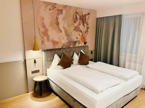 Postel nebo postele na pokoji v ubytování Hotel Hecher