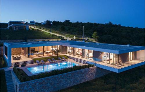 an aerial view of a house with a swimming pool at Villa Kalipso in Nova Vas