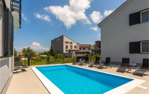 a swimming pool in the middle of a building at Awesome Apartment In Vrbnik With Wifi in Vrbnik