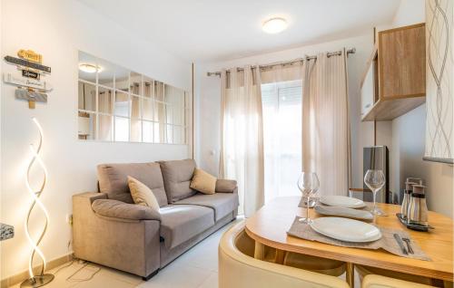 a living room with a couch and a table at Charming Apartment With Pool in Vera