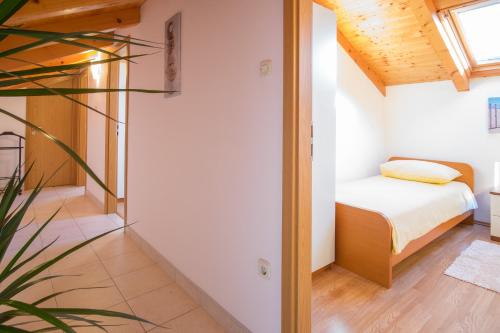 a bedroom with a bed and a window at Villa Vita in Polje