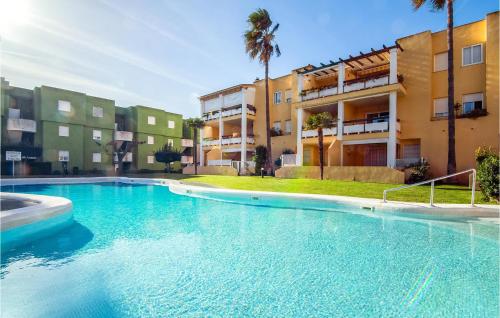 a large swimming pool in front of a building at Nice Apartment In Xeraco With Wifi in Xeraco