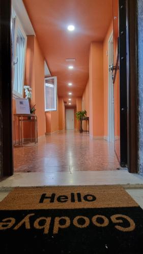 an empty hallway with a hino astro rug on the floor at BAM BAM TIBURTINA Guesthouse in Rome