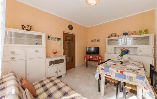 a living room with a table and some furniture at Holiday Home Kature Iv in Labin