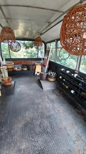 an inside view of a bus with a room at Grado8punto8 Glamping Valle de Los Artistas in Lolol