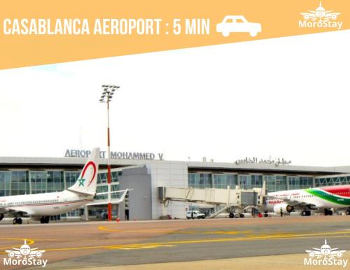two airplanes are parked at an airport at AeroHarmony in Nouaceur