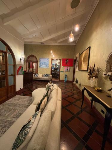 a living room with a couch and a table at The Victorian Hotel in San José