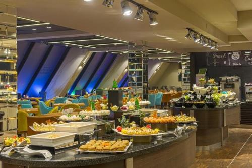 a buffet line with plates of food on display at Банско in Bansko