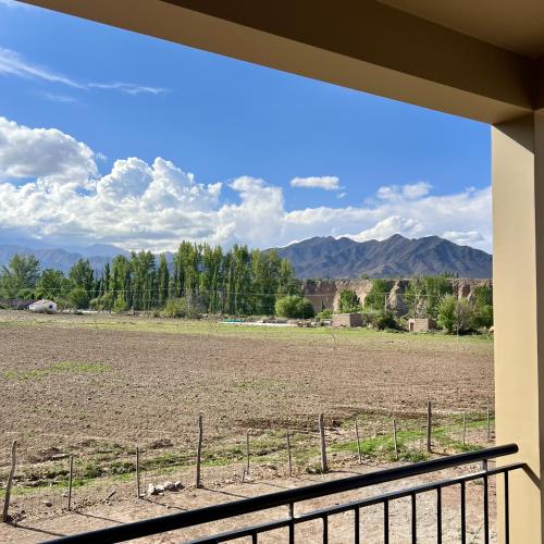 a view of a field from a porch at Lo de Nieves - Casas con hermosa vista al Nevado y gran ubicación in Cachí