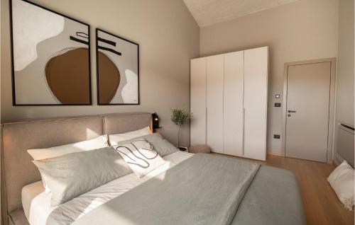 a bedroom with a large bed with two pillows at Villa Silente in Bale