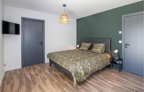a bedroom with a bed and a pendant light at Lovely Home In Cléon D'andran in Cléon-dʼAndran
