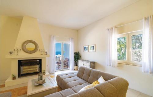 a living room with a couch and a fireplace at Amazing Home In Blato With Wifi in Blato