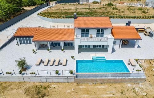 an aerial view of a house with a swimming pool at Villa Bella Draguc in Draguć