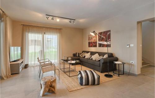 a living room with a couch and a table at Villa Brih Iii in Motovun