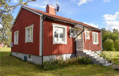 a red house with a red roof at 2 Bedroom Gorgeous Home In Alstermo in Alstermo