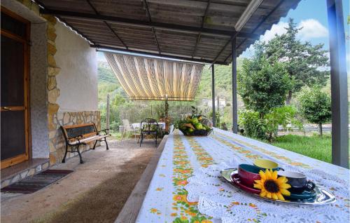 a table with plates of food on top of it at 3 Bedroom Nice Home In Campodimele in Campodimele