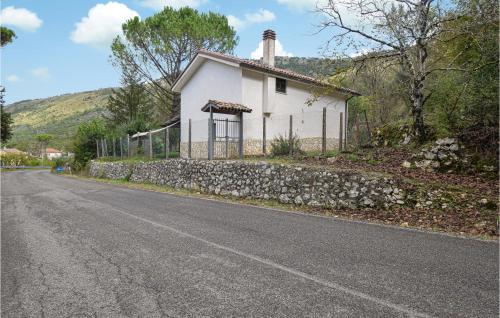 a small white house on the side of a road at 3 Bedroom Nice Home In Campodimele in Campodimele