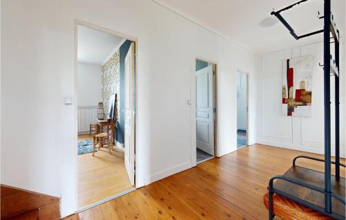 a white room with a mirror and a table at 4 Bedroom Gorgeous Home In Jarnac in Jarnac