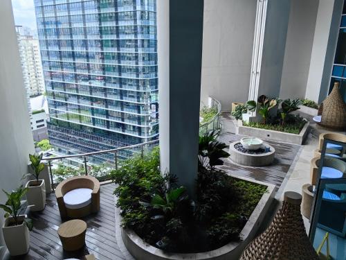 a view of a building from the top of a building at Cozy 1BR with Balcony and Netflix in Uptown BGC in Manila