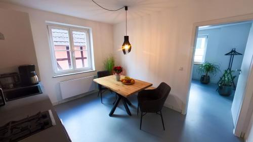 a small room with a table and chairs and a window at Erftstege#2 in Bad Münstereifel